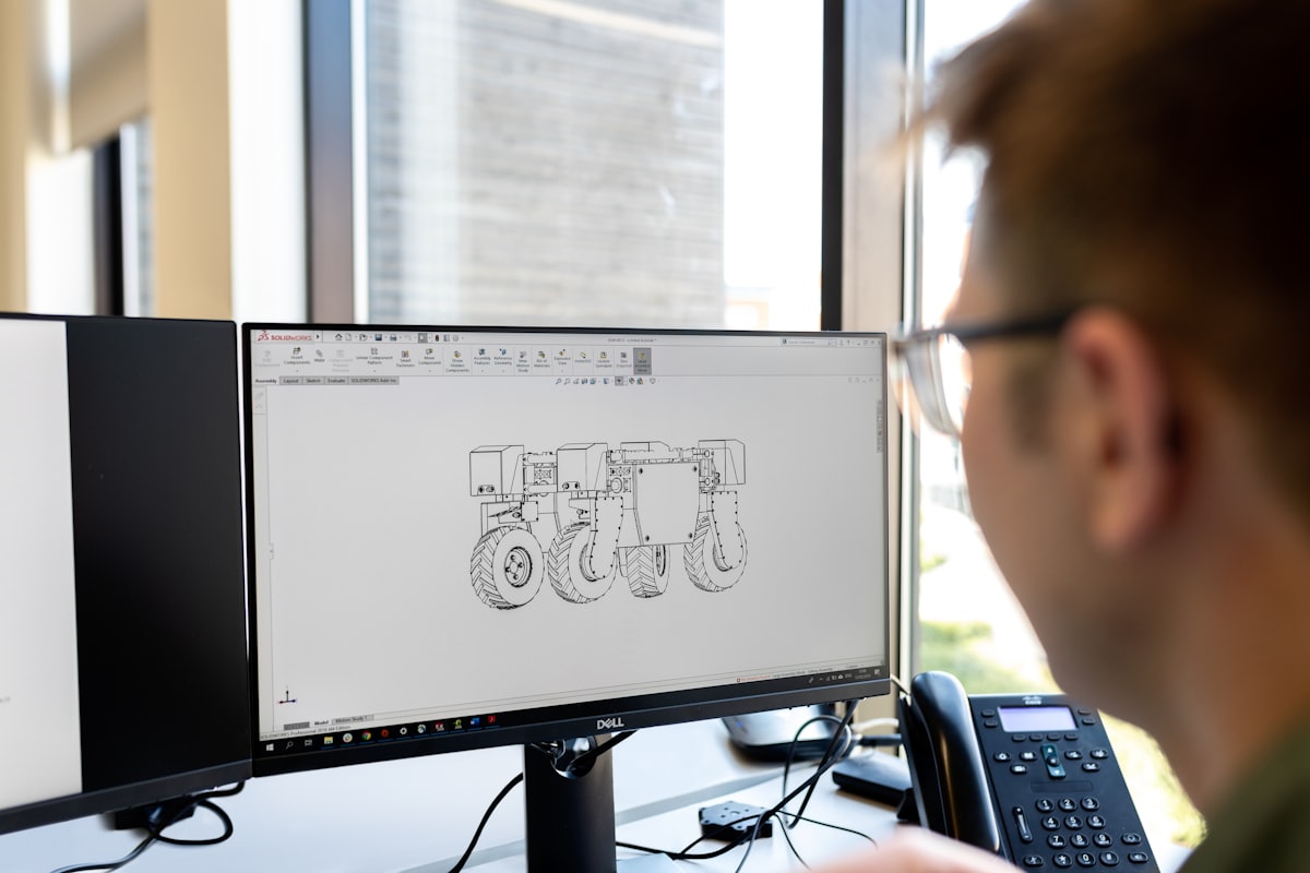 Engineer modelling a part in CAD software