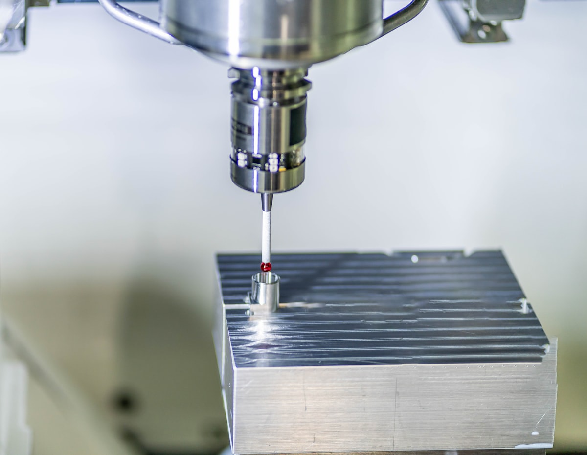 Touch probe measuring a machined block
